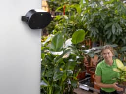 AXIS C1110-E from AXIS COMMUNICATIONS - on wall in plantshop